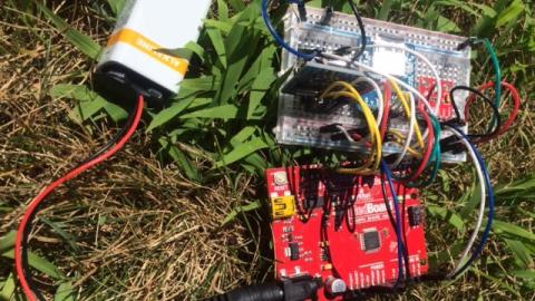Arduino boards on the ground in grass