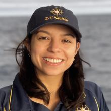 Coralie standing on deck of Nautilus