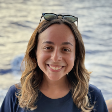 Paola Santiago-Padua stands in front of the ocean