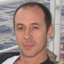 Fedir sits on deck