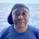 Jorge Nunez headshot with ocean background