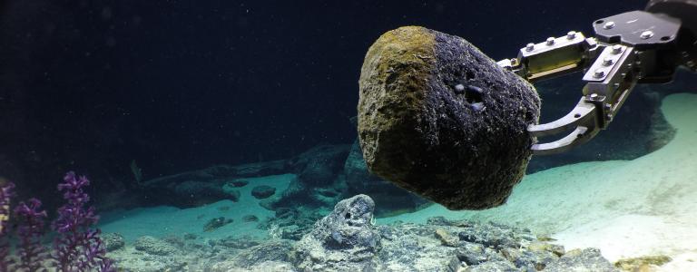 ROV Hercules takes a large basalt sample