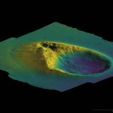 Side on view of the Norbit model showing mroe sharply definies hills rising fro one side of an amphitheater shaped seafloor depression