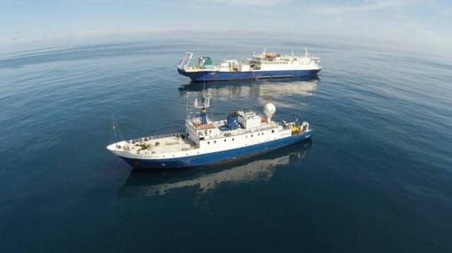 Nautilus next to a large cable ship