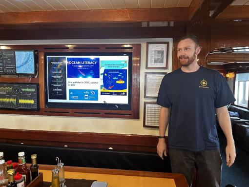 Science Communication Fellow Kyle Menter hosts an onboard workshop on Ocean Literacy!