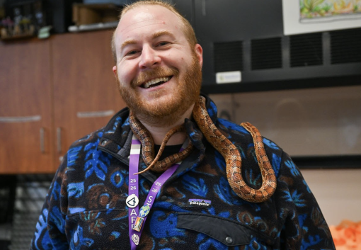 SCF Matt Holden with a snake around his neck
