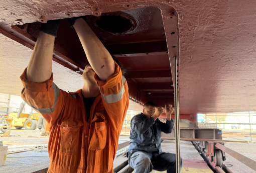 Crew members installing the new sonar on E/V Nautilus.