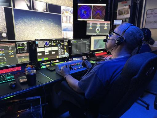 ROV pilot in control van of E/V Nautilus