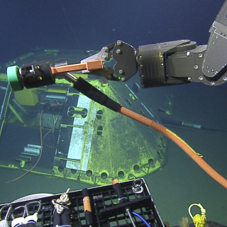 plugging in cable into underwater observatory